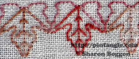 hand embroidered area of a needlework sampler  detail