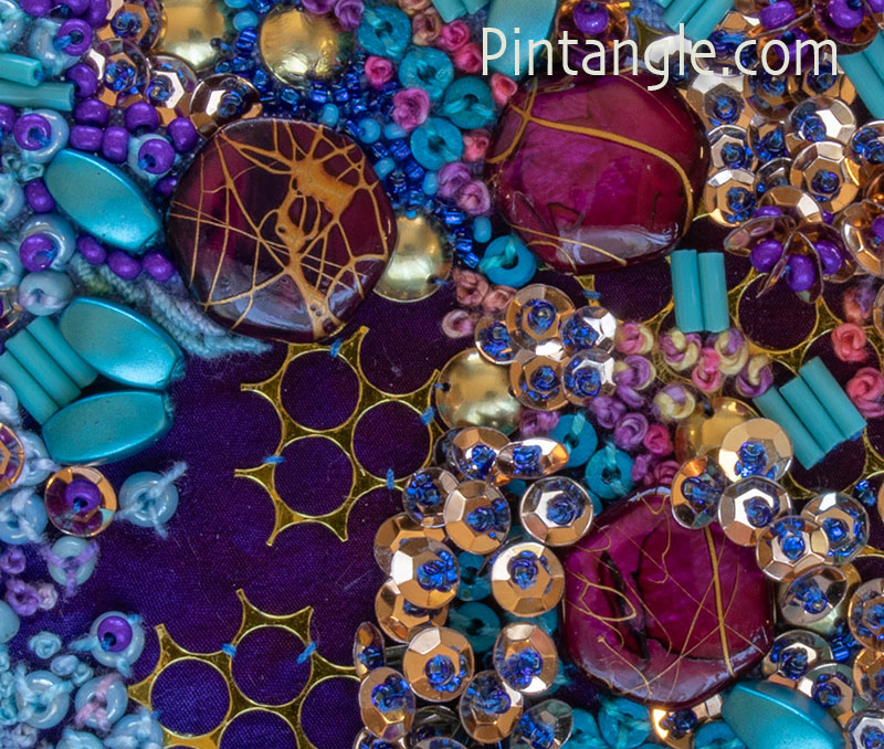 close detail of beads,sequins and hand embroidery